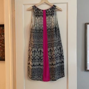 Fun navy/white patterned dress with bold pink stripe in back.